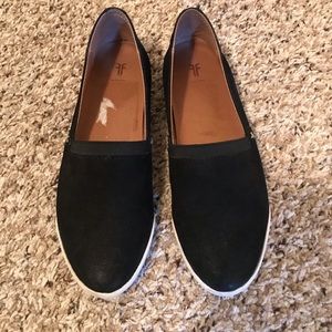 Frye slip-on shoes, black and white.